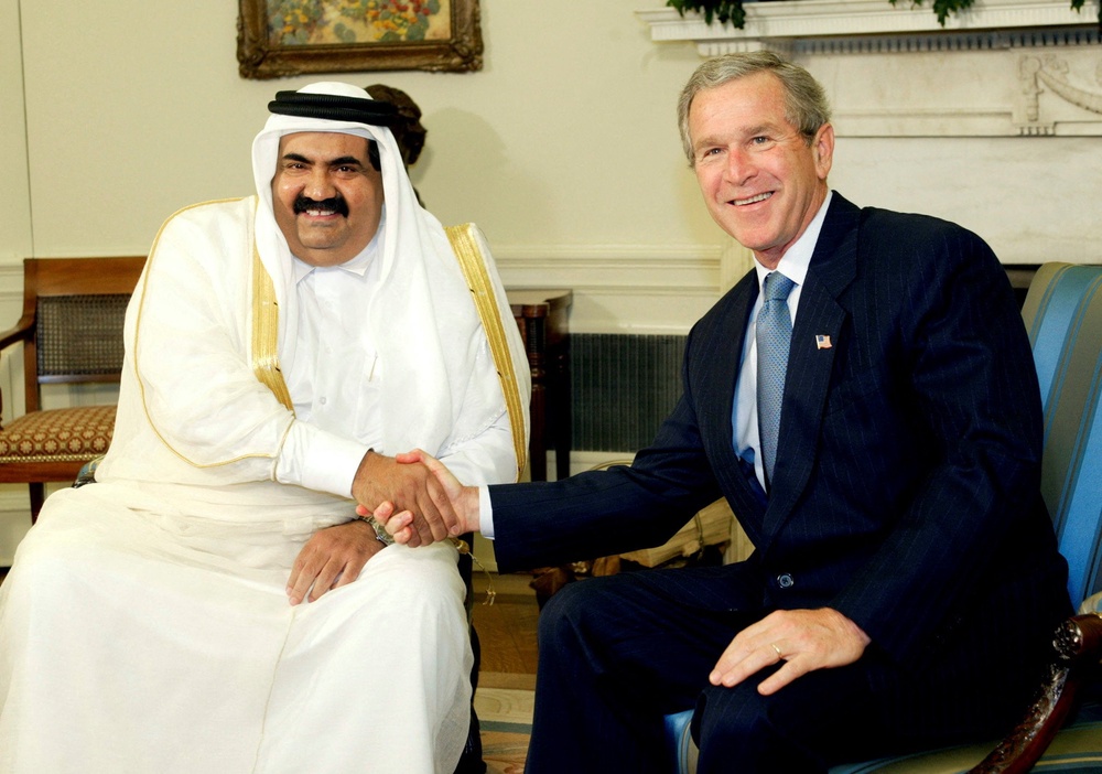 US president George W Bush with Sheikh Hamad bin Khalifa al-Thani of Qatar in the Oval Office of the White House, Washington DC, on 8 May 2003 (Reuters)