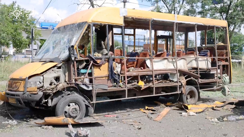A damaged vehicle sits on a road, following a Russian airstrike, amid Russia's attack on Ukraine, in Sumy, Ukraine (Reuters)
