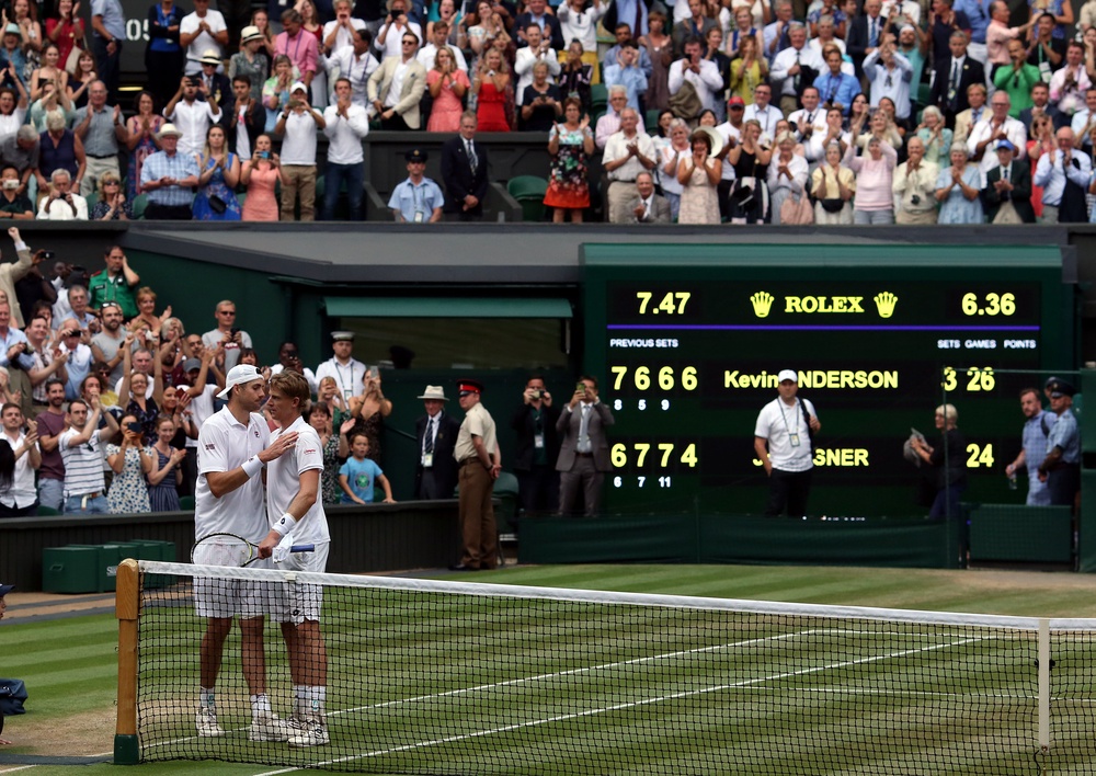 Kevin Anderson (right) and John Isner finished the longest semi-final in the Wimbledon history on this day in 2018 (PA Archive)