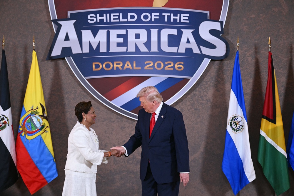 President Donald Trump poses with Trinidad and Tobago's Prime Minister Kamla Persad-Bissessar (AFP/Getty)
