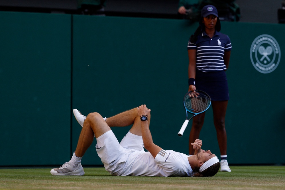 Zverev fell as he slipped behind the baseline trying to chase down Sinner’s drop shop (Reuters)