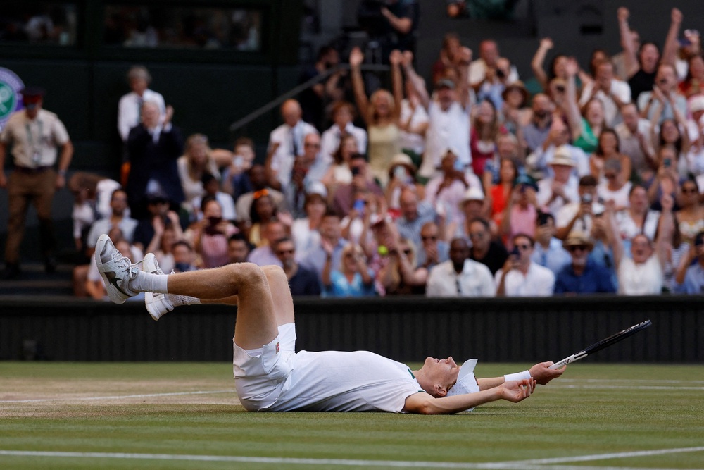Sinner falls onto his back after beating Zverev in four tight sets (Reuters)