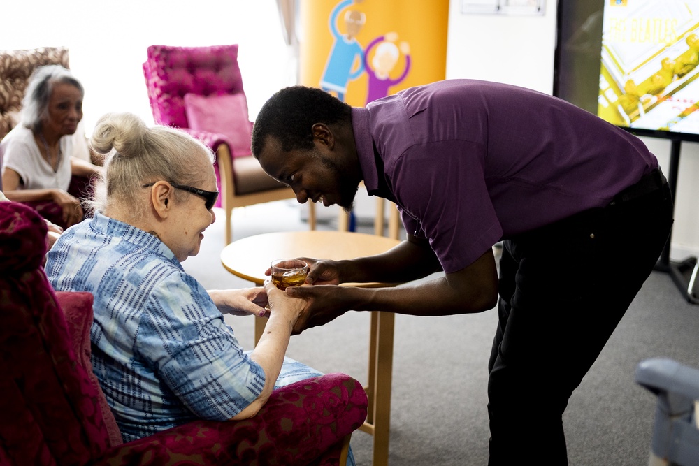 Residents staying cool by drinking refreshments at Norton House Care Home in London (Jordan Pettitt/PA) (PA Wire)
