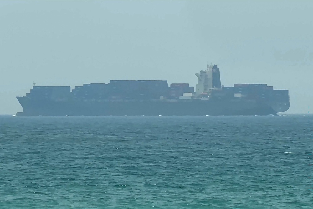 This frame grab taken from AFPTV video footage on July 12, 2026 shows a cargo ship anchoring near the Strait of Hormuz off the eastern coast of the United Arab Emirates at Khor Fakkan (AFP/Getty)