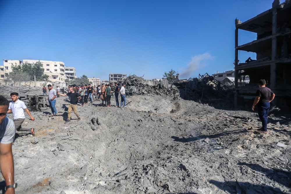 People inspect the damage after the Israeli air strikes on July 12, 2026 in Gaza City, Gaza (Getty)