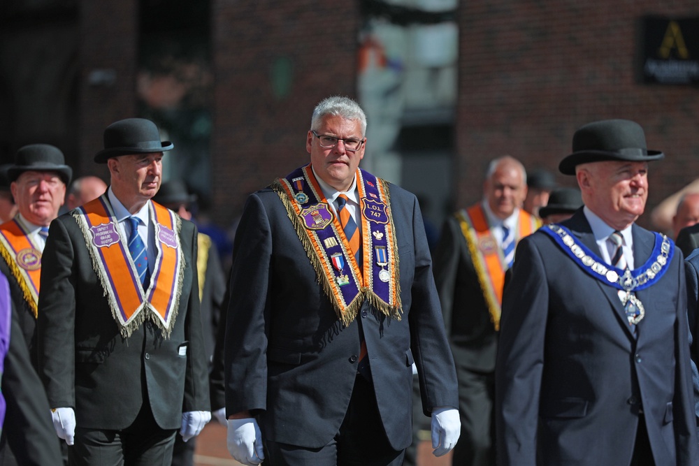 DUP leader Gavin Robinson (centre) during the Orange Order’s parade in Belfast (Liam McBurney/PA) (PA Wire)