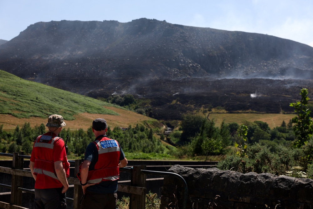 The Dovestone Reservoir fire has left large swathes of earth scorched (Reuters)