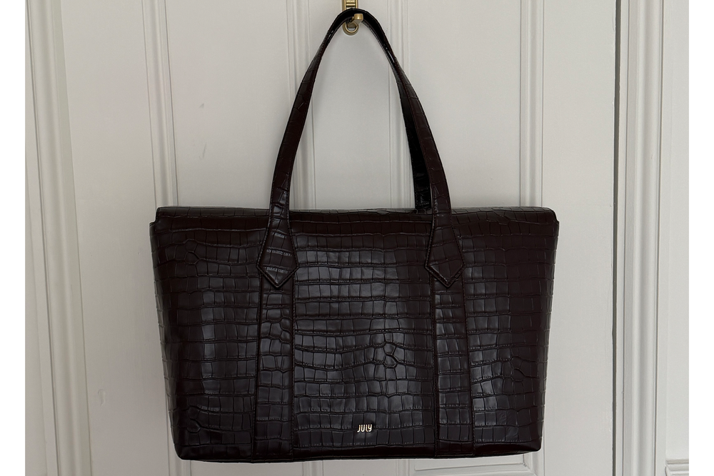The croc print leather makes this bag work trip appropriate (Harriet Davey/The Independent)