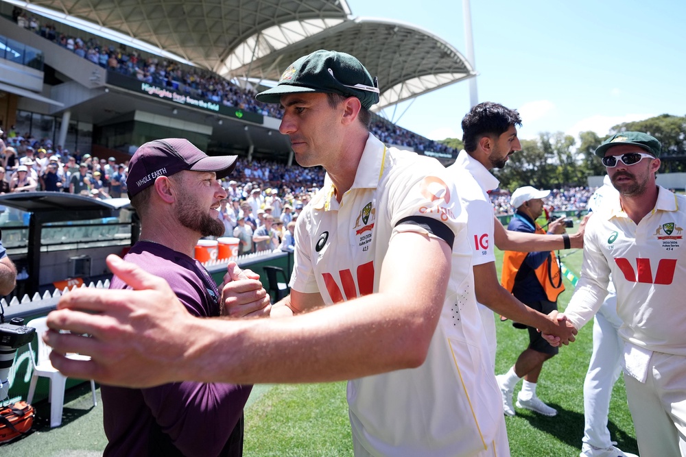 McCullum, left, congratulates Australia captain Pat Cummins during last winter’s Ashes (Robbie Stephenson/PA) (PA Archive)