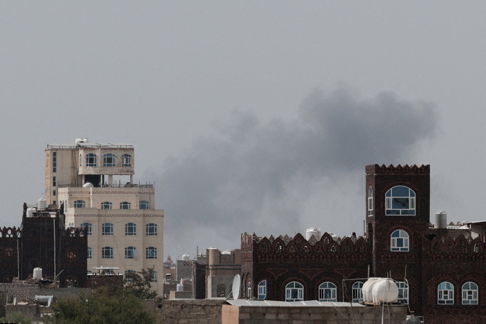 Smoke rises following an airstrike after Yemen's defense ministry said that its armed forces had targeted the runway at Sanaa International Airport, in Sanaa, Yemen (Reuters)