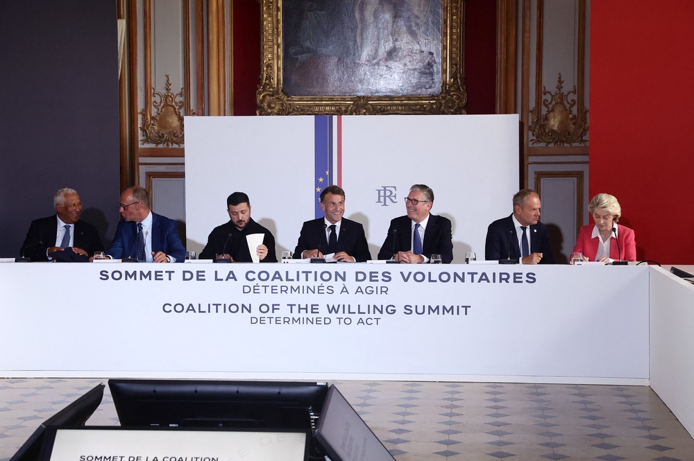 (LtoR) European Council President Antonio Costa, German Chancellor Friedrich Merz, Ukrainian President Volodymyr Zelensky, French President Emmanuel Macron, British Prime Minister Keir Starmer, Polish Prime Minister Donald Tusk, and European Commission President Ursula von der Leyen attend take part in a summit of the Coalition of the Willing to support Ukraine at the Hotel des Invalides in Paris on July 13, 2026. (AFP/Getty)