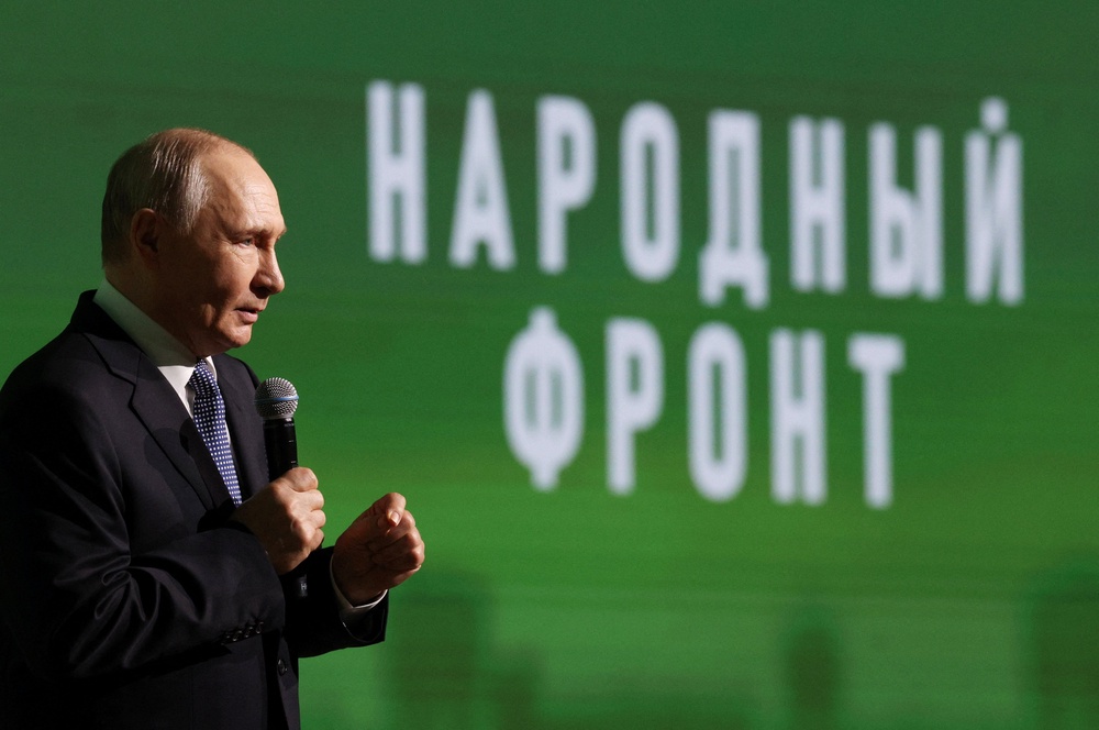 Russian president Vladimir Putin takes part in the forum ‘Everything for Victory’ organised by People's Front in Moscow (Reuters)