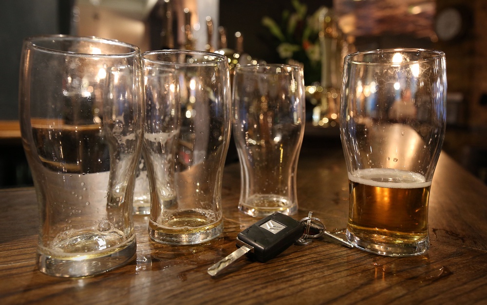 Beer glasses and a set of car keys on a bar in a pub in central London (PA)
