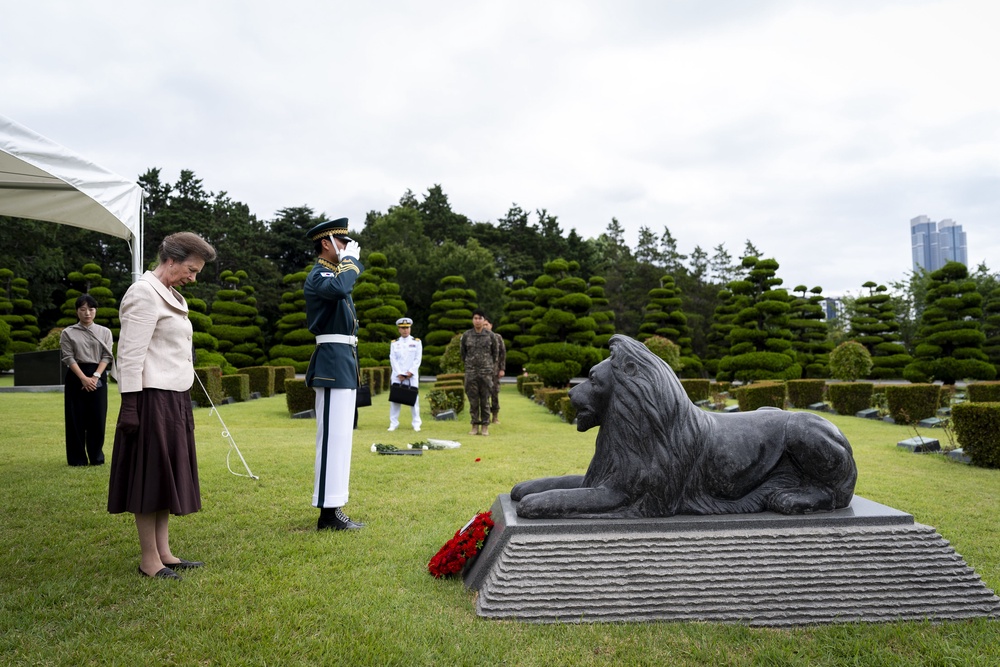 Anne stands in front of the lion statue which stands in honour of UK servicemen who died in the Korean War (Jordan Pettitt/PA) (PA Wire)