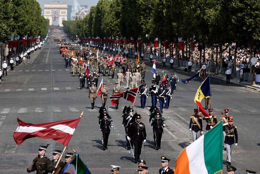 Soldiers from countries of the Coalition of the Willing march during the annual Bastille Day military parade on the Champs-Elysees avenue in Paris (Reuters)