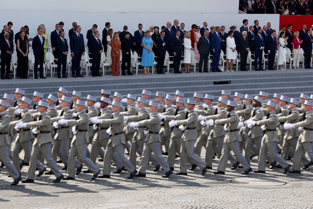 French President Emmanuel Macron, his wife Brigitte Macron, Ukraine's President Volodymyr Zelenskiy and his wife Olena Zelenska, Heads of State and Government of the Coalition of the Willing and members of the French government attend the annual Bastille Day military parade (Reuters)