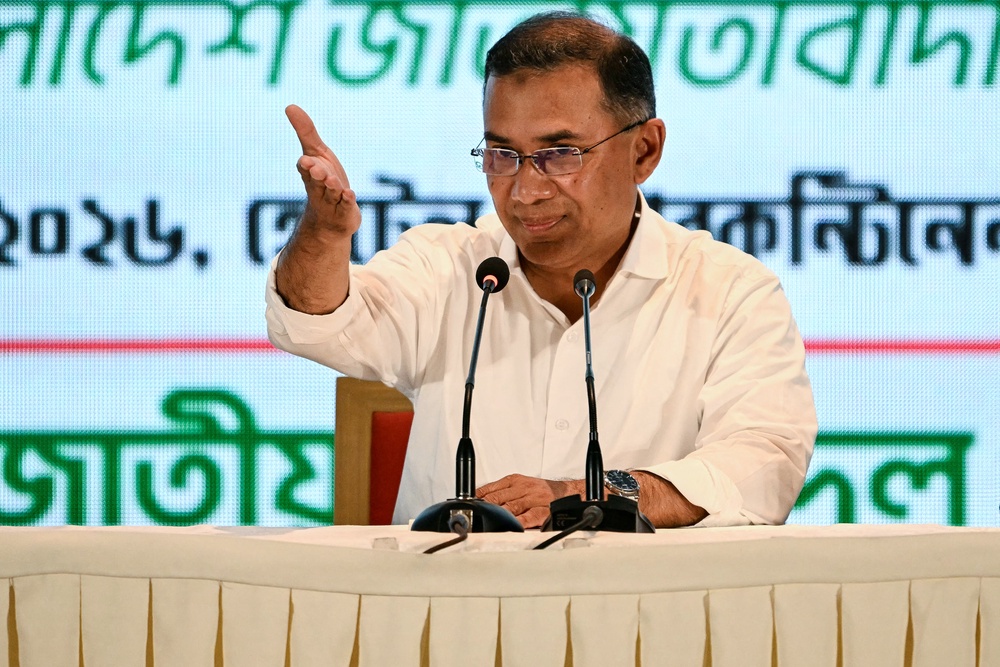 Bangladesh Nationalist Party (BNP) chairman Tarique Rahman gestures towards the media during a press conference in Dhaka on 14 February 2026 (AFP/Getty)