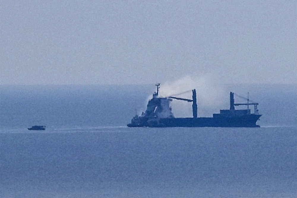 A civilian vessel is on fire, as Ukraine's navy spokesman reported a Russian military strike on a civilian vessel (Reuters)