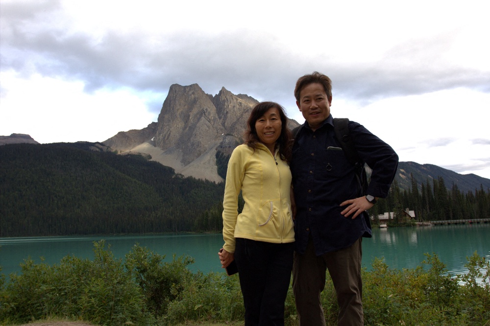 Dr. Yufang Rong and her husband Dr. Youlin Chen, an American seismologist held for nearly two years by China, pose together at Emerald Lake, Yoho National Park, British Columbia, Canada (Reuters)