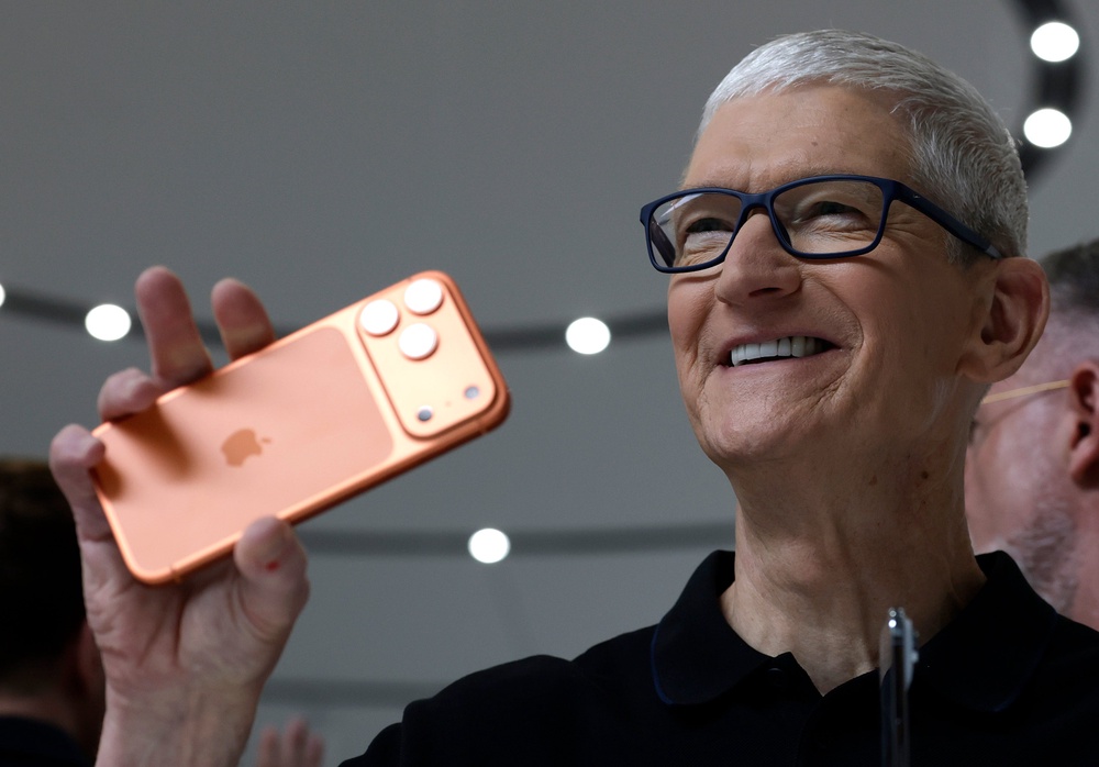 Apple CEO Tim Cook holds up a new iPhone 17 Pro during an Apple special event at Apple headquarters on September 09, 2025 in Cupertino, California (Getty)