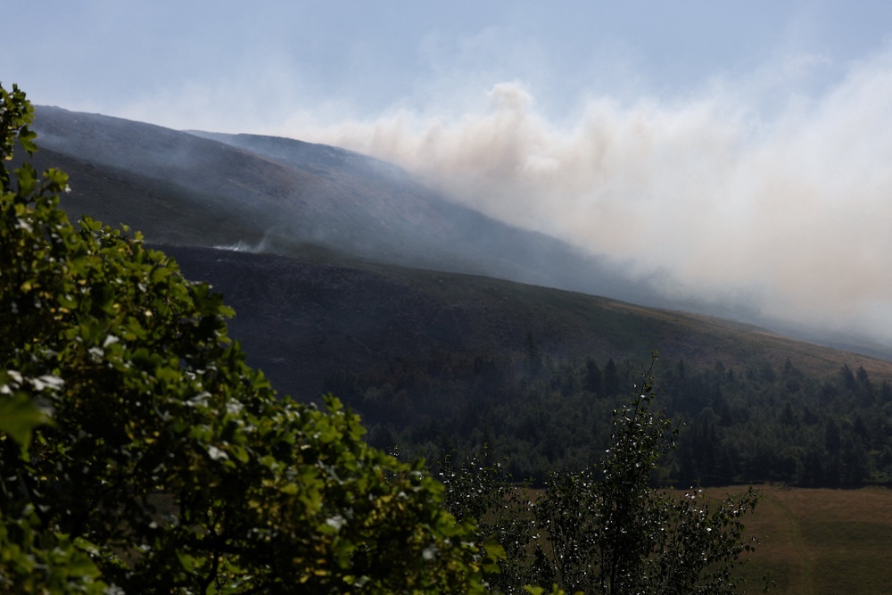 Smoke rises near the reservoir (Reuters)