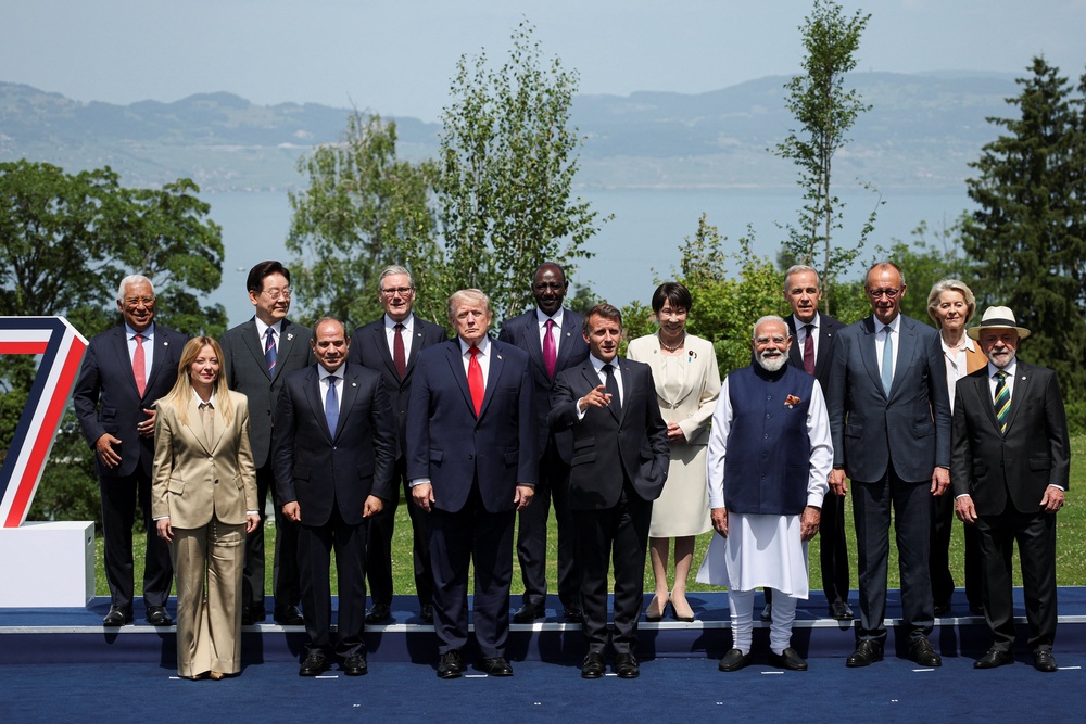 Mr Trump with the other G7 leaders (PA) (PA Wire)