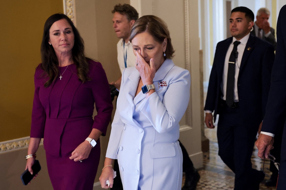 Darline Graham wipes away tears as she leaves the Senate floor after visiting her late brother's desk, before her swearing-in to fill his seat Tuesday. (Reuters)