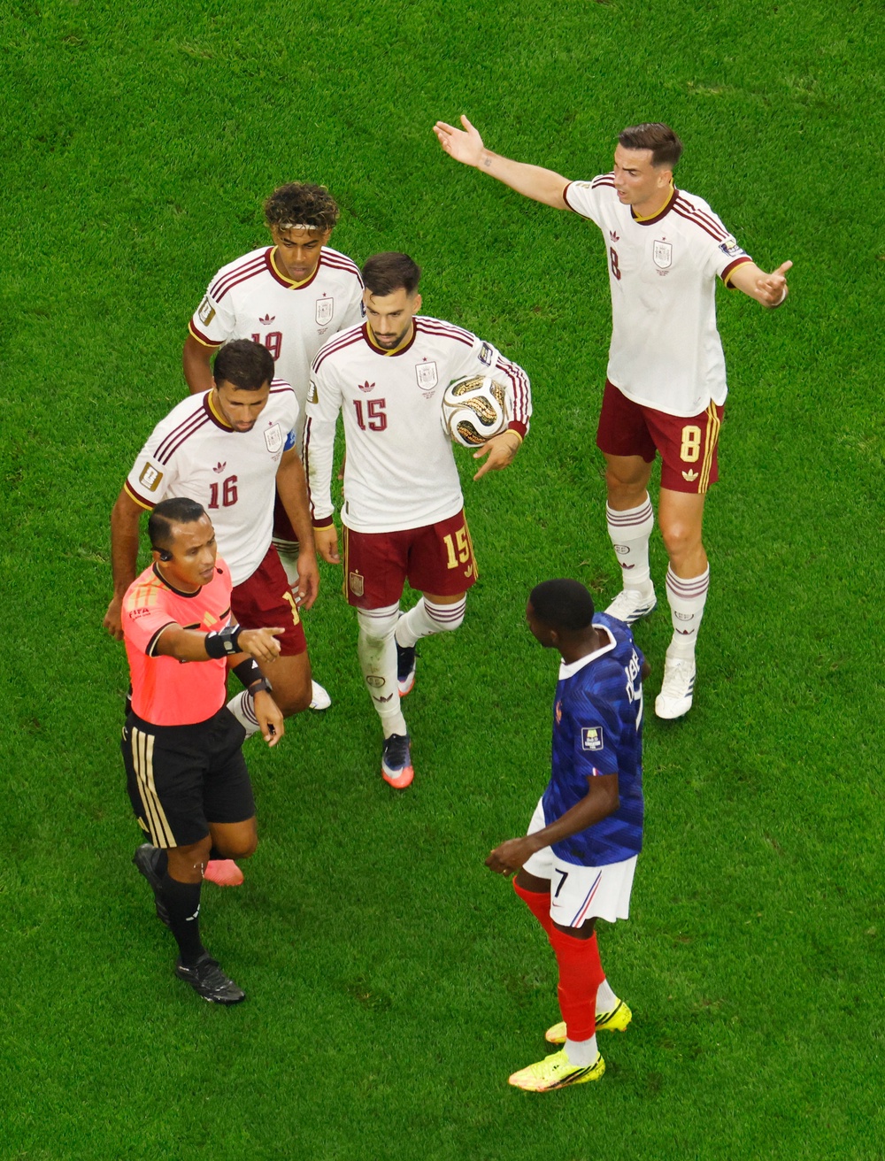 Spain's Rodri, Alex Baena, Lamine Yamal and Fabian Ruiz remonstrate with referee Ivan Barton (Reuters)