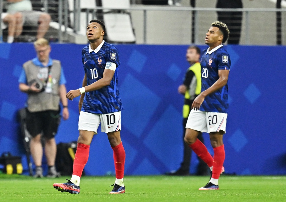 Mbappe and Doue look dejected after defeat (Reuters)