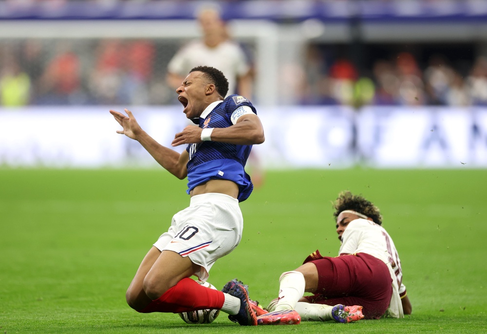 Kylian Mbappe of France competes for the ball against Lamine Yamal of Spain (Getty)