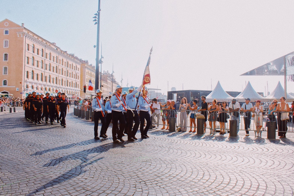 Wide view of a French Fire and Rescue Service unit marching during the Bastille Day military parade on the Old Port in Marseille, Provence Alpes Cote d Azur (AFP/Getty)