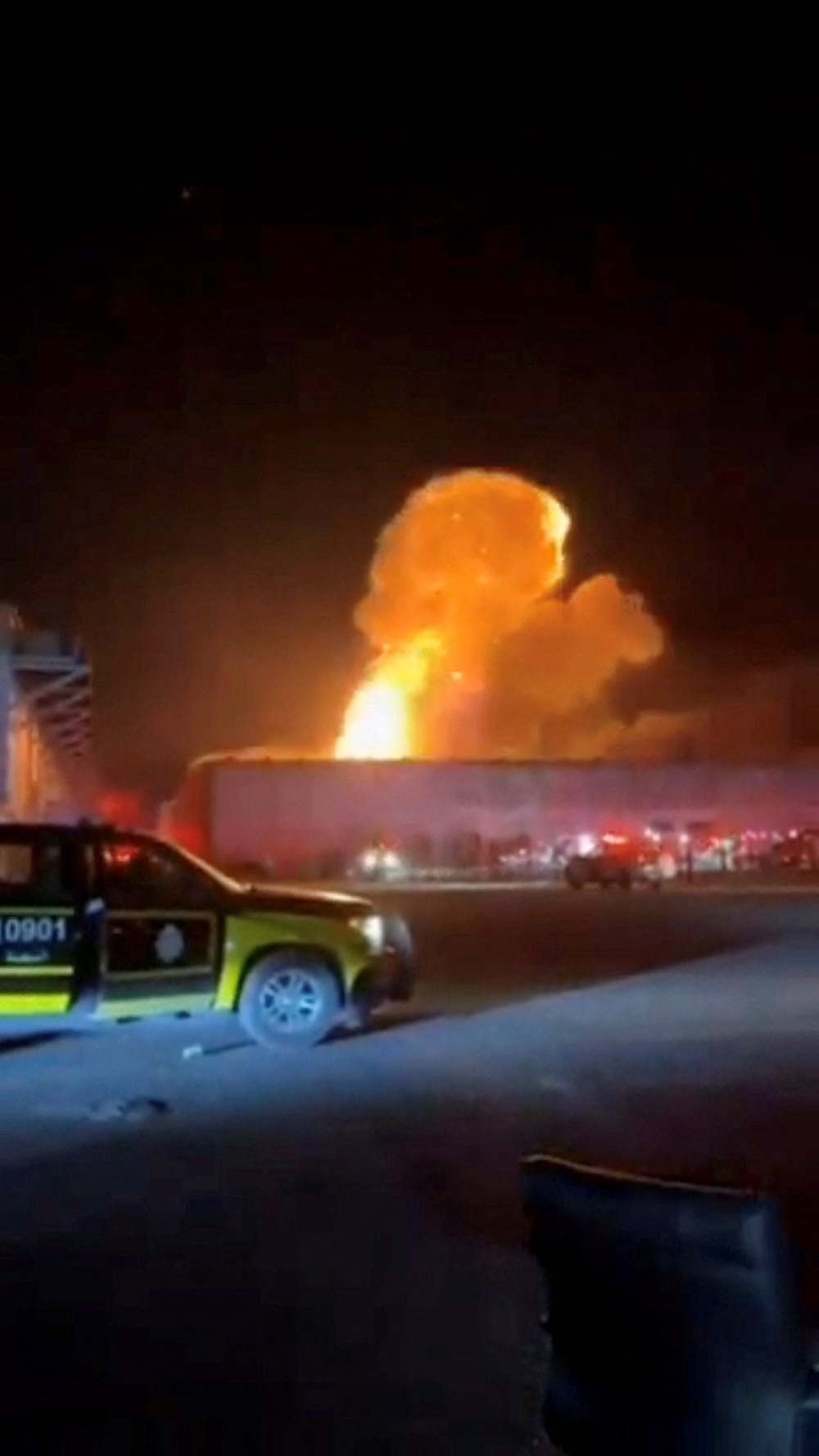 Smoke rises from an explosion following a drone strike on a warehouse in Al Shuaiba, Kuwait, in a video shared on 14 July (Social media)
