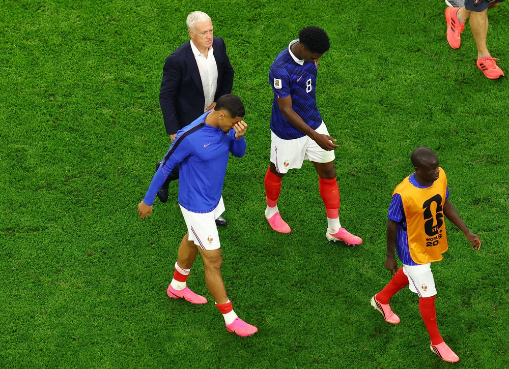 France’s William Saliba, Aurelien Tchouameni, and coach Deschamps look dejected after the match (Reuters)
