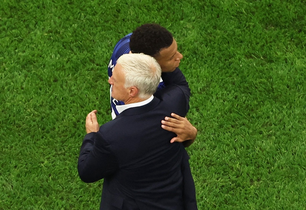 Kylian Mbappe with his coach after the match (Reuters)