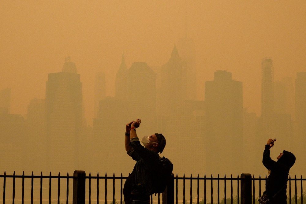 New York City isn't expected to see a repeat of the orange skies from June 2023, pictured here, but should still prepare for hazy skies and unhealthy air quality (AFP/Getty)