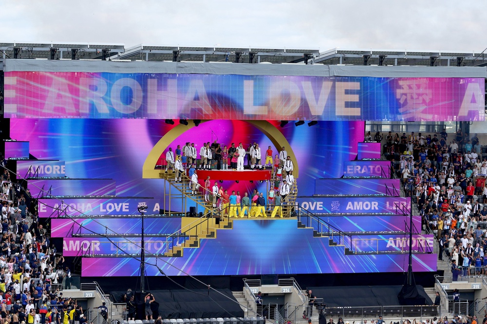 Chris Martin of Coldplay and Emmanuel Kelly perform during the halftime show during the Fifa Club World Cup 2025 Final match between Chelsea FC and Paris Saint-Germain (Getty)
