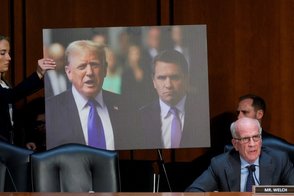 Senators displayed an image of Trump and hos former personal attorney, whom he now seeks to install as attorney general, Todd Blanche, during the hearing. (Reuters)