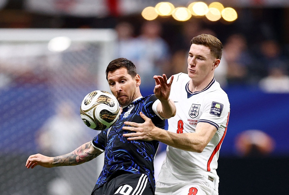 Messi battles England’s Elliot Anderson in midfield (Reuters)