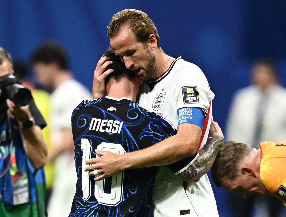 Argentina's Lionel Messi hugged England's Harry Kane at the end of the match (Reuters)