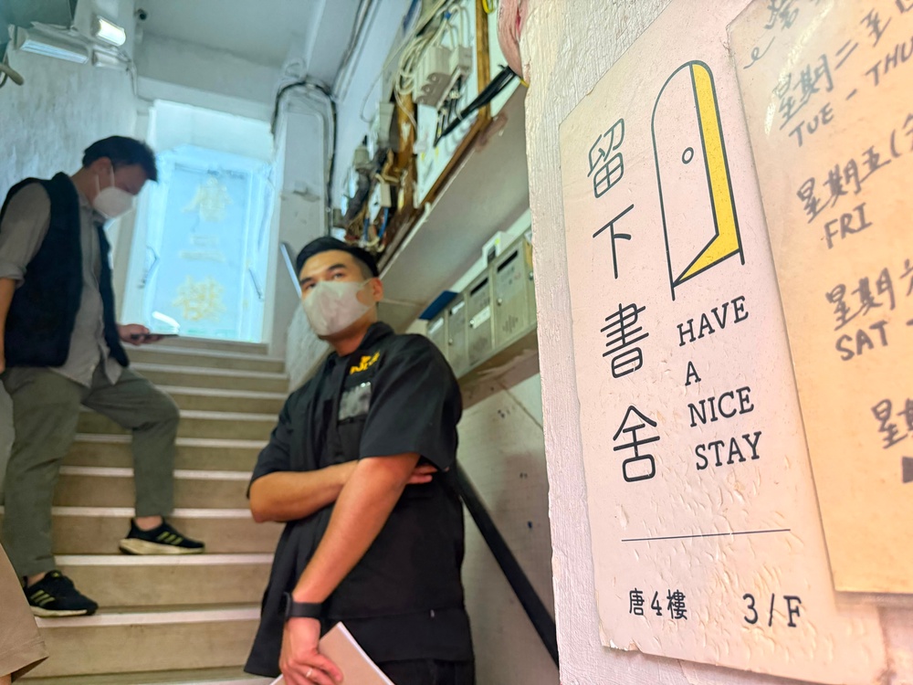 Police officers stand by the entrance to the 