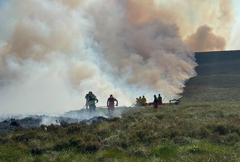 Firefighters tackling the wildfire (RSPB Scotland/PA) (RSPB Scotland)