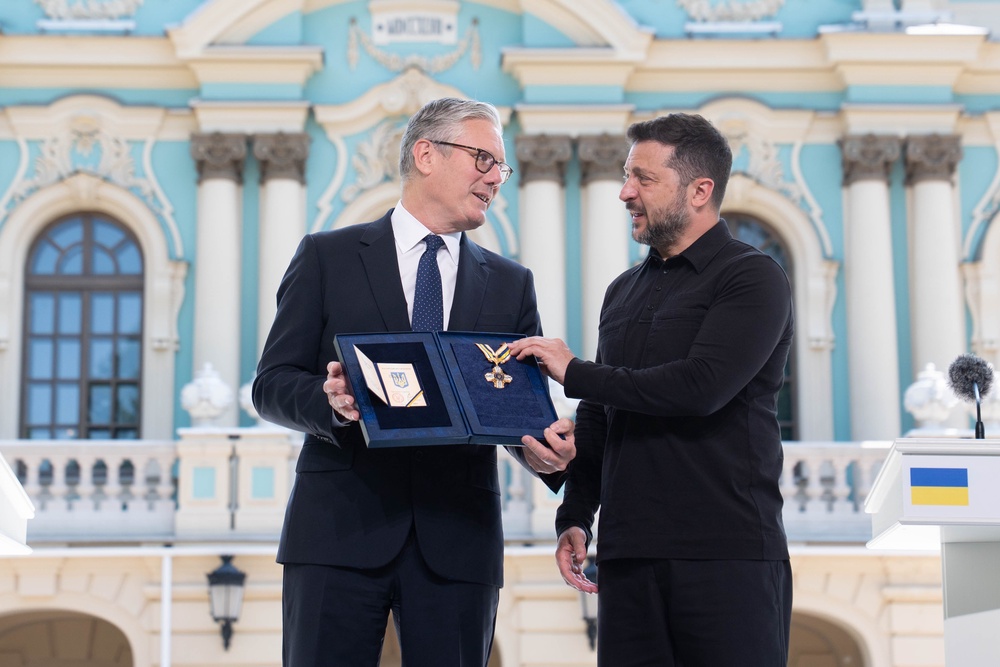 Sir Keir Starmer is presented with the Order of Freedom by Volodymyr Zelensky in the gardens of the Presidential Palace in Kyiv (Stefan Rousseau/PA) (PA Wire)