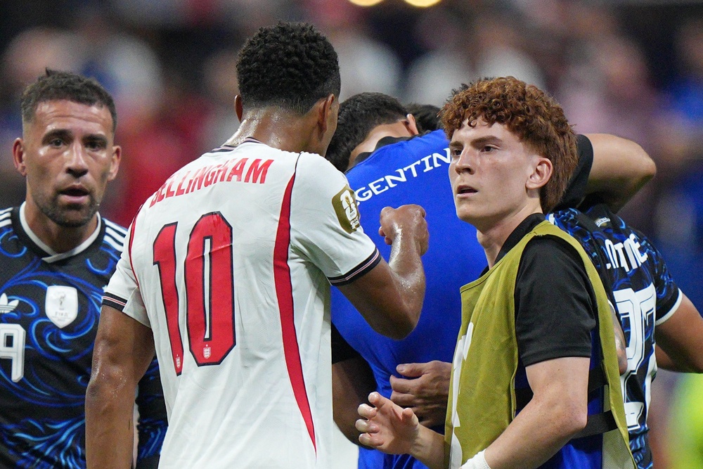 Bellingham approaches Barco after the game (AP)