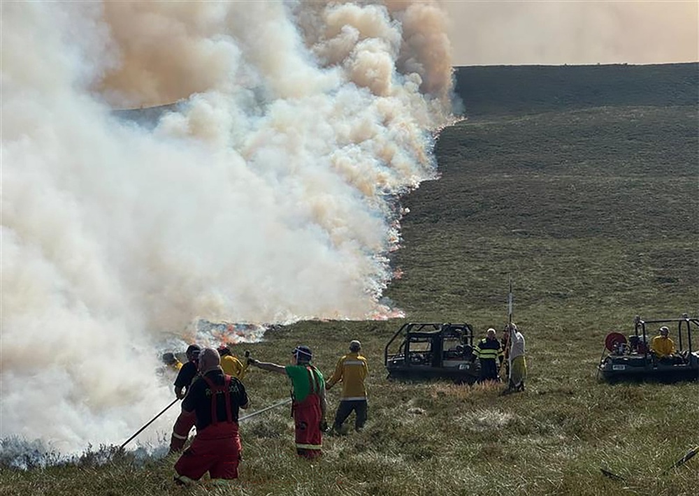 Staff and volunteers are trying to prevent the flames spreading (RSPB Scotland/PA) (PA Media)