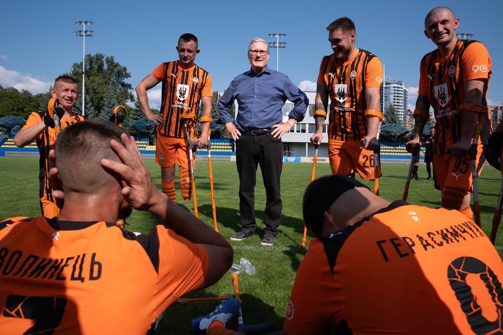 The Prime Minister met members of a war veterans amputee football team (Stefan Rousseau/PA) (PA Wire)