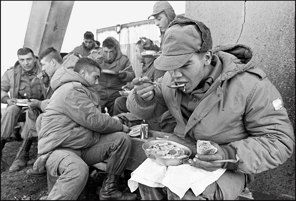 Argentine soldiers have lunch at the partially destroyed former Royal Marines base, 13 April 1982 (AFP/Getty)