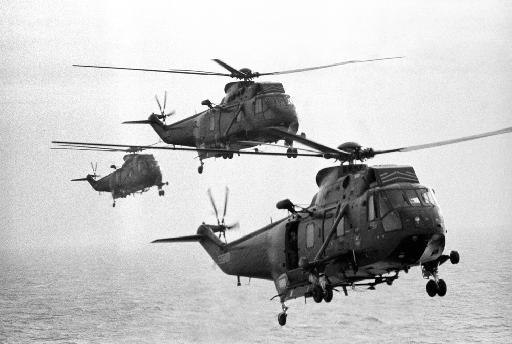 Sea king helicopters from the carrier HMS Hermes flying in formation during a practice sortie from the vessel as she makes her way south with the British naval task force heading for the Falkland Islands following the Argentinian invasion (PA)