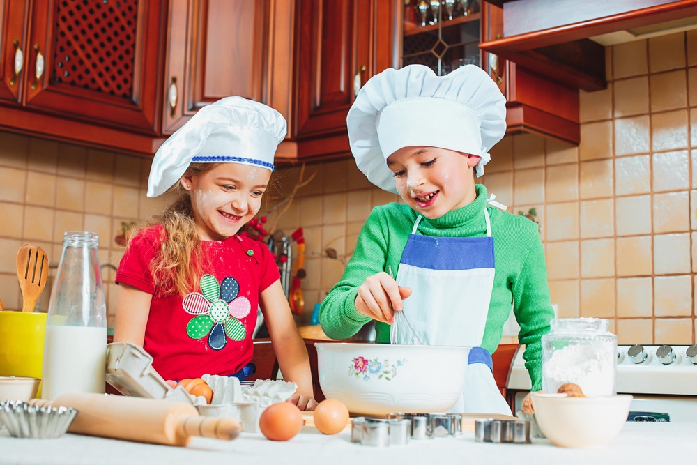 Giving children a task such as preparing a family meal can stave off boredom. (Alamy/PA)