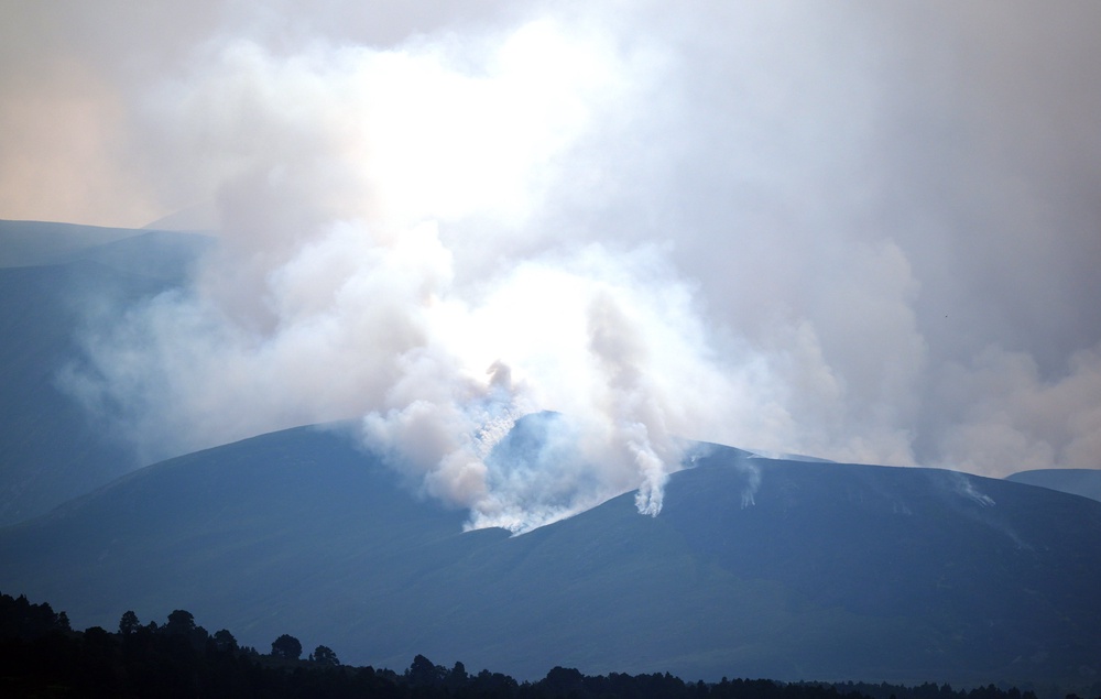 A wildfire in the Cairngorms has entered its third day, as blaze reports across the country soar (PA)