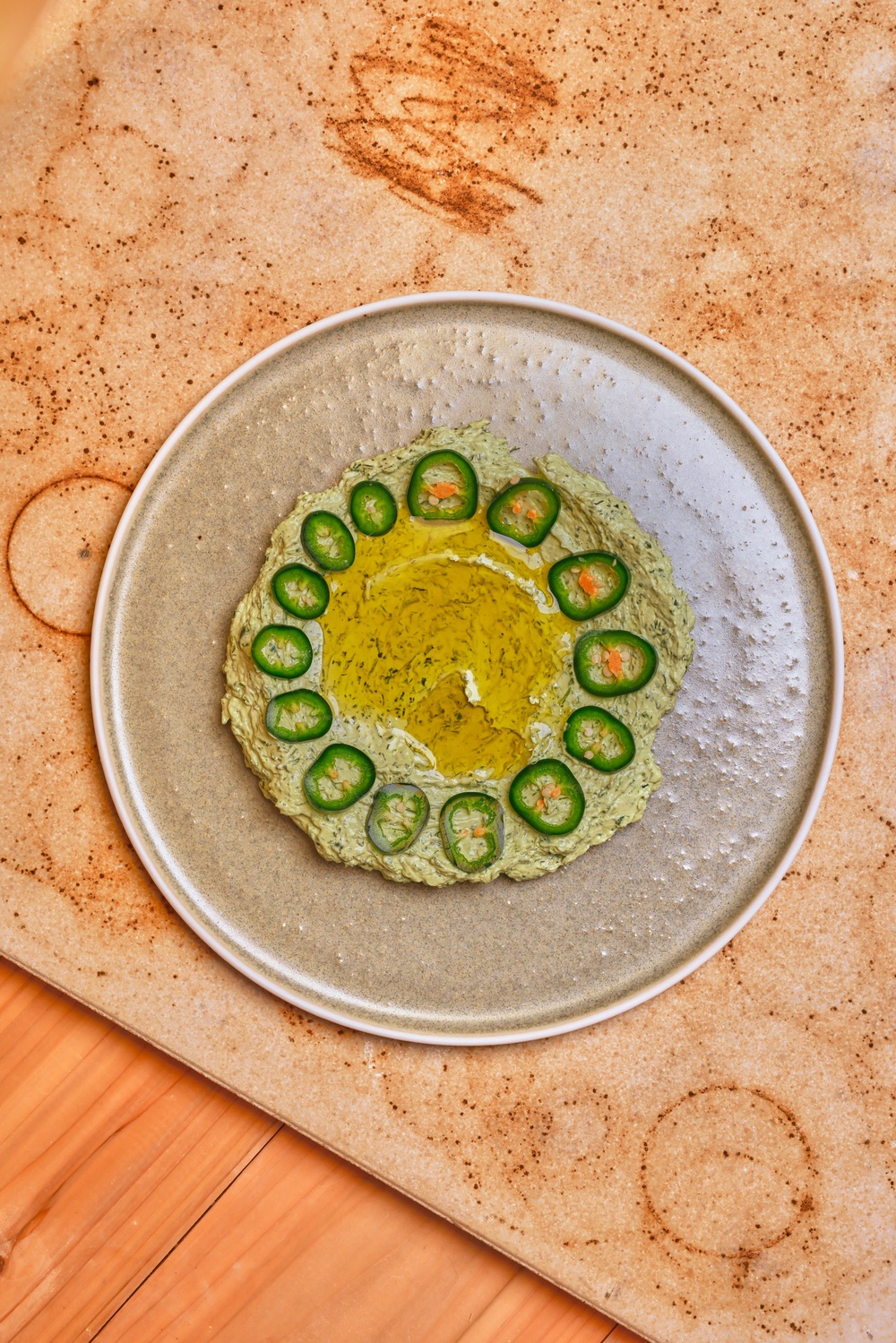 Thick, tangy labneh brightened with fresh herbs, jalapeño and a generous pour of olive oil (Rich Cullen/Kiln)